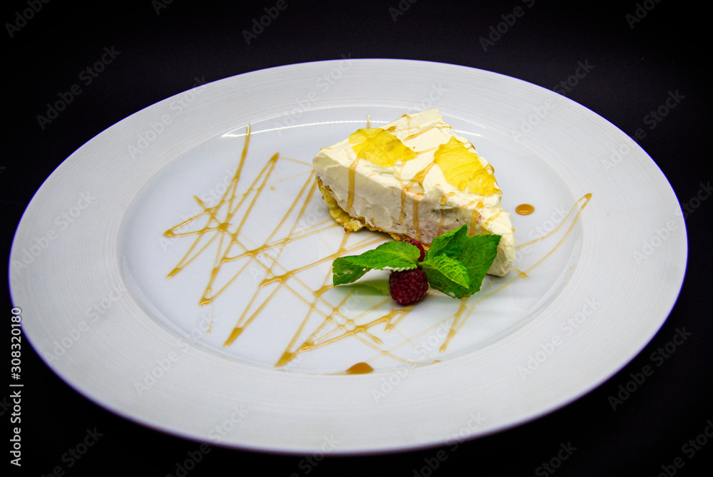 Lemon cheesecake on black background Lemon cheesecake on black background