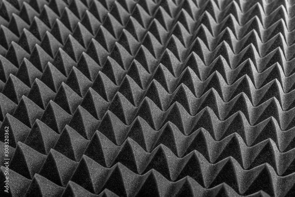Abstract background in the form of pyramids and dragon scales. Acoustic black foam rubber. Abstract background in the form of pyramids and dragon scales. Acoustic black foam rubber.