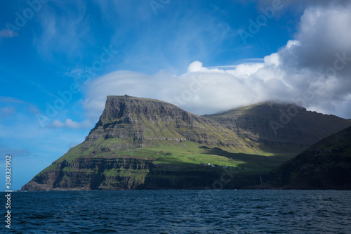 Green cliffs and hills in Faroe Islands © Gabi