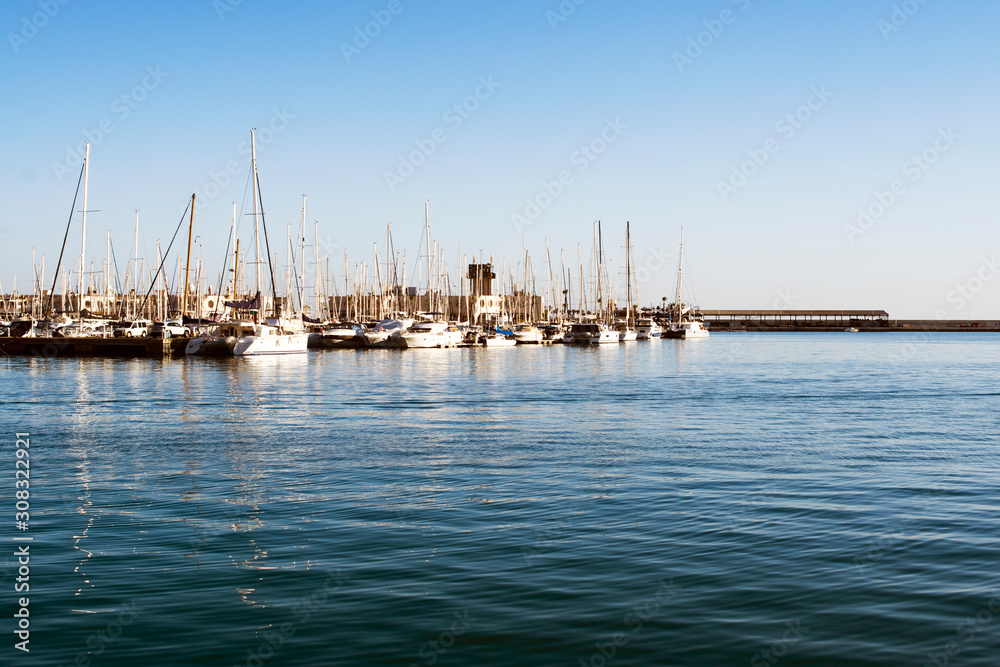 city ​​port with pleasure boats on the horizon