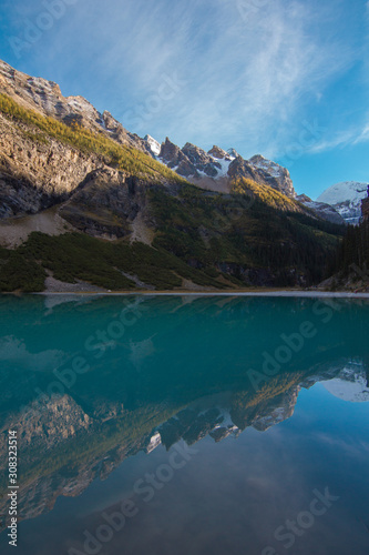 Reflection of mountains in a blue glacial lake in Banff  Canada