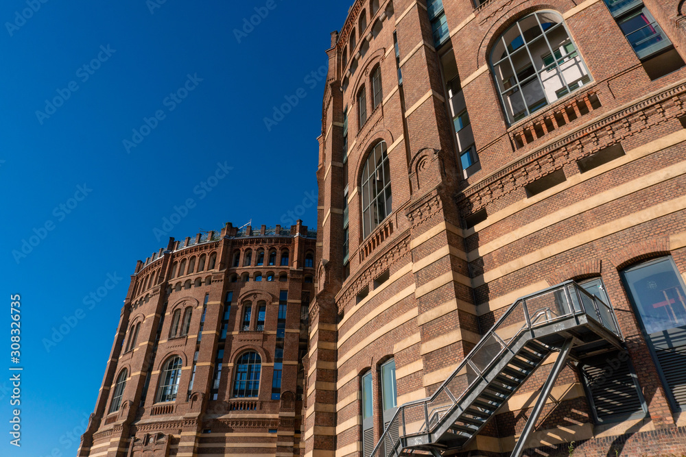 Vienna, Austria - October 2019: The Gasometer Buildings in Vienna, Austria are former natural gas storage facilities that were converted into residential appartment buildings