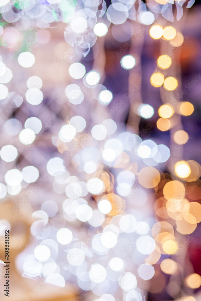 Fototapeta premium Festive blur background. Abstract twinkled bright background with bokeh defocused golden lights