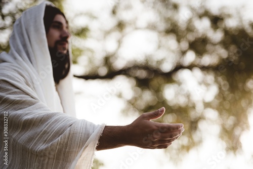 Shallow focus shot of Jesus Christ lending a helping hand photo