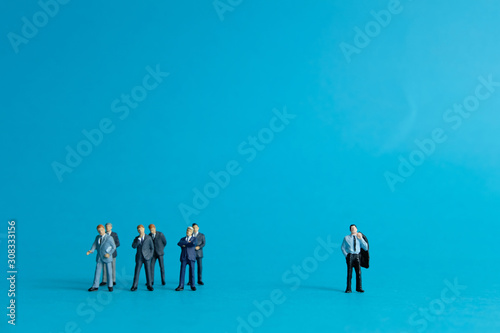 businessman miniature people concept - inequality in office workplace