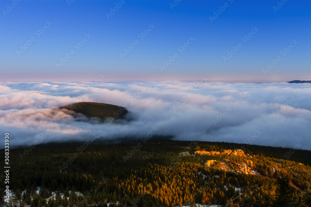 Sunrise and Inversion at Jested mountain close town Liberec, Czech republic, snow and winter and view of funicular.