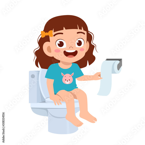happy cute kid girl sit on the toilet