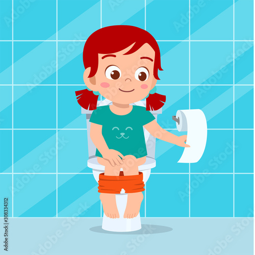 happy cute kid girl sit on the toilet