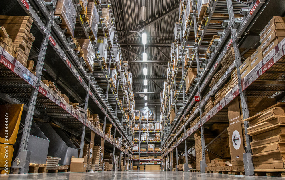 low viewpoint of high storage scaffolding of a Warehouse of a big furniture shop low viewpoint of high storage scaffolding of a Warehouse of a big furniture shop