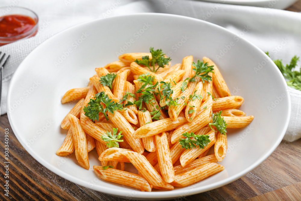 Plate with tasty pasta on table Plate with tasty pasta on table
