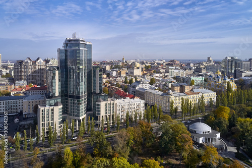 Aerial view at green cityscape with high-rise houses © Andriy Bezuglov