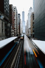 Poster Zwart Metro tussen wolkenkrabbers in New York  © Temi Ogunwumi/Wirestock