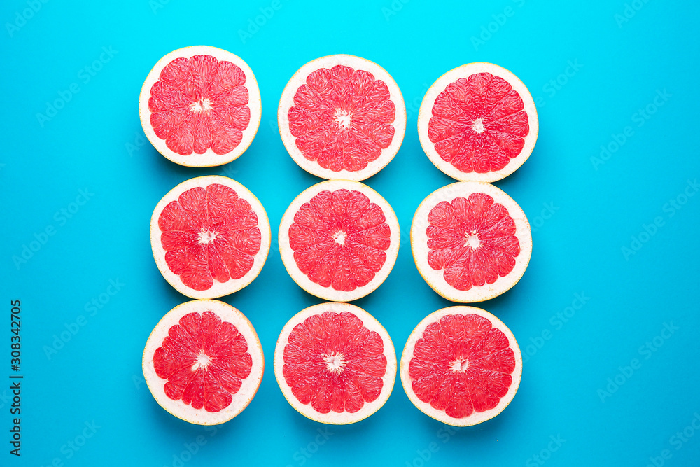 Fresh cut grapefruit on color background Fresh cut grapefruit on color background