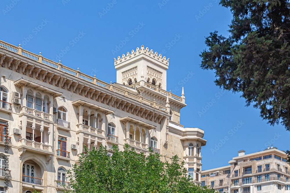Large beautiful building with square turrets against the sky