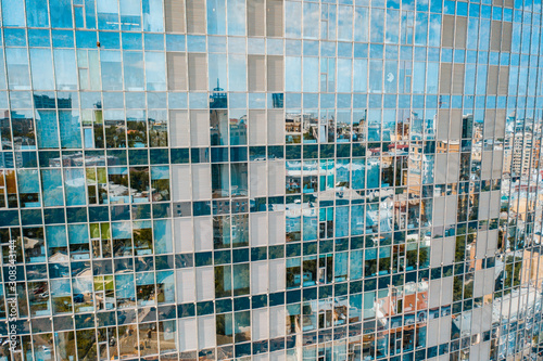 Street reflection on glass steel building facade