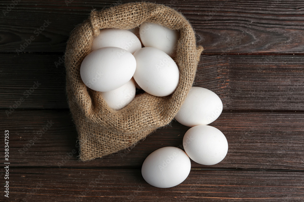 Bag with fresh raw eggs on table Bag with fresh raw eggs on table