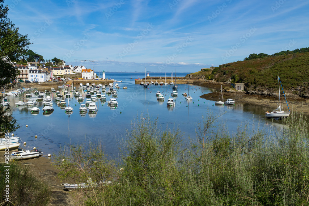 Boats in the port of Sauzon at low tide during a sunny day, Belle-île, Brittany