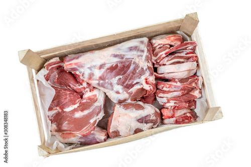 Fresh and raw sheep or lamb meat pieces for sale on box from the farm . on white background photo