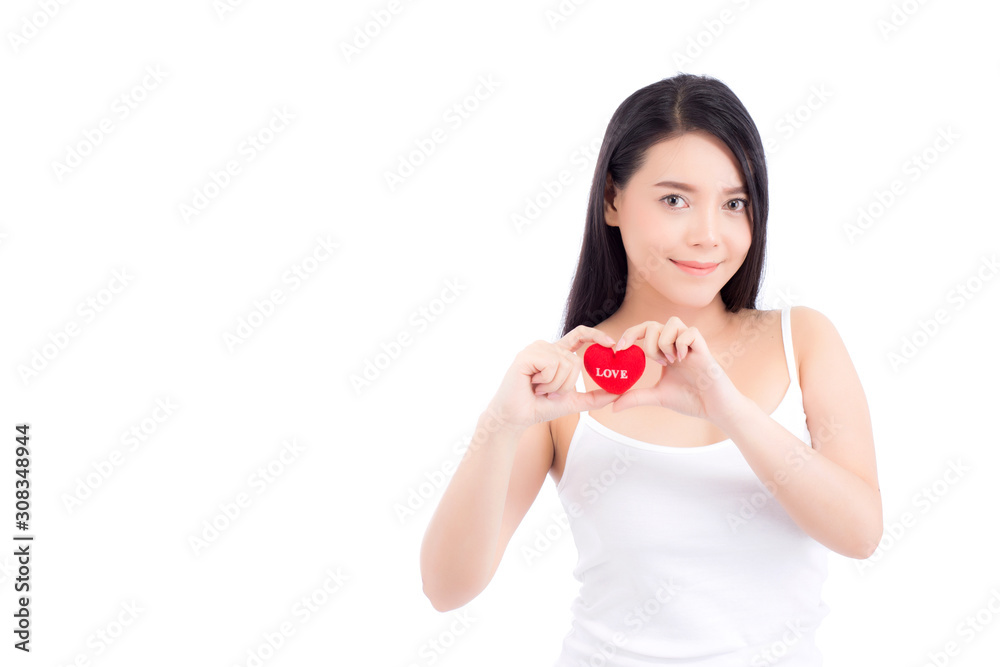 Portrait of beautiful asian young woman holding red heart shape pillow and smile isolated on white background, valentines day, holiday concept. Portrait of beautiful asian young woman holding red heart shape pillow and smile isolated on white background, valentines day, holiday concept.