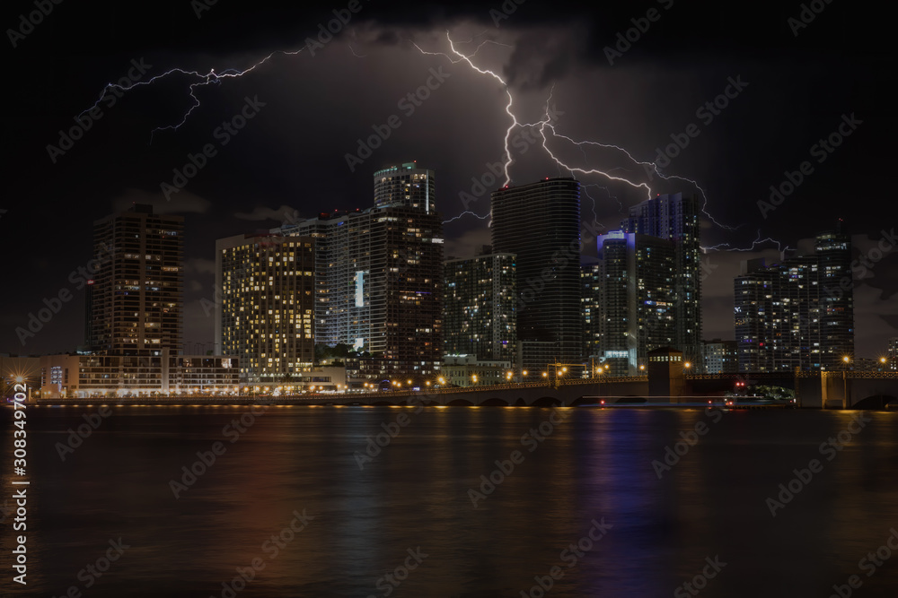 Fototapeta premium lightning strikes behind the big city