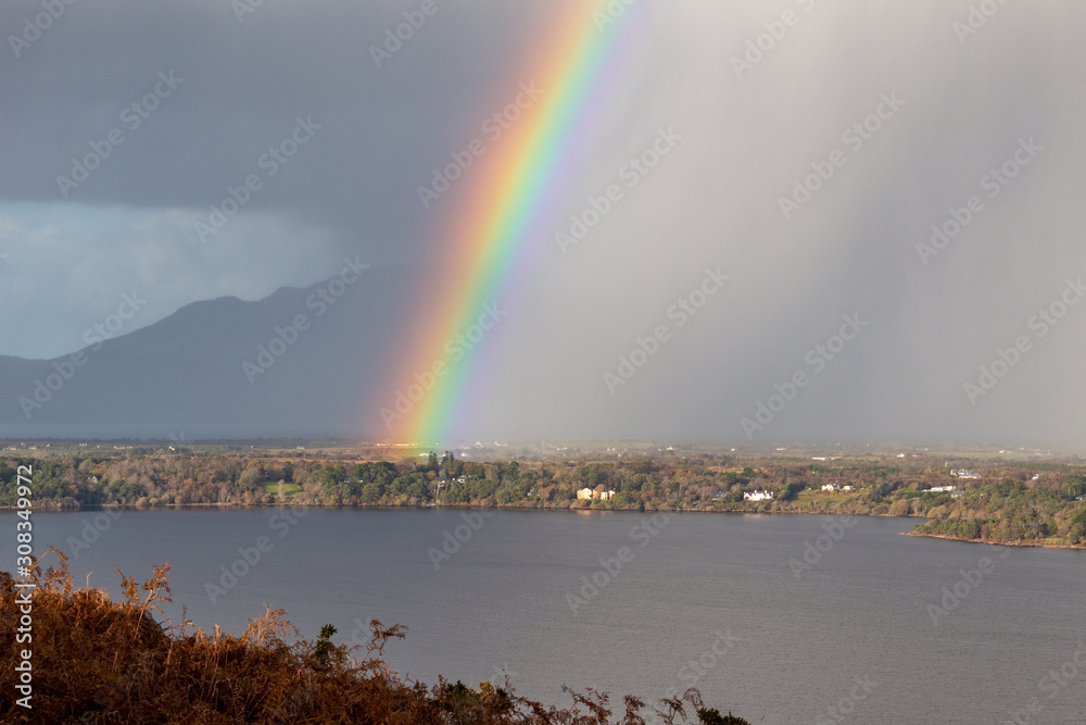 Fototapeta premium Rainbow and Rain Clouds over Caragh Lake in County Kerry, Ireland