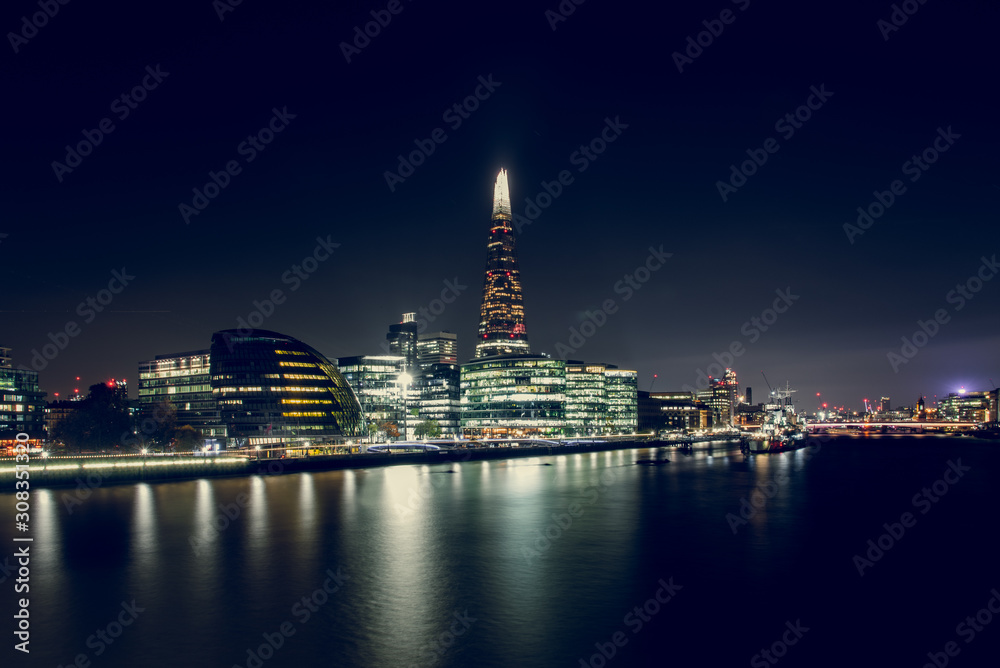 View of Illuminated Buildings at Night With the Shard in the Middle, in the City of London, UK