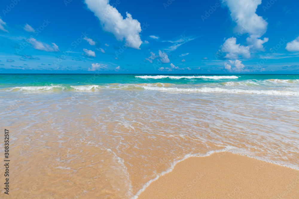 Colorful sea beach wave with blue sky fluffy cloud Colorful sea beach wave with blue sky fluffy cloud