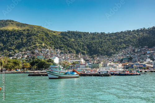 View of the port and city of Angra dos Reis with boats and pier for landscaping, state of Rio de Janeiro Brazil South America