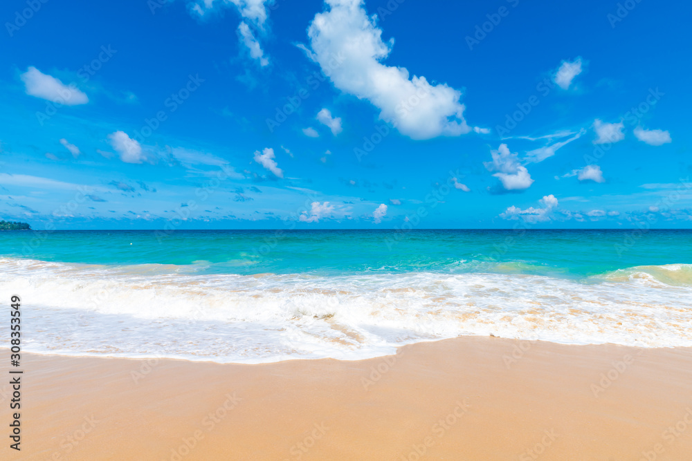 Fototapeta premium Colorful sea beach wave with blue sky fluffy cloud