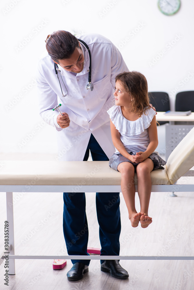 Young doctor pediatrician with small girl Young doctor pediatrician with small girl