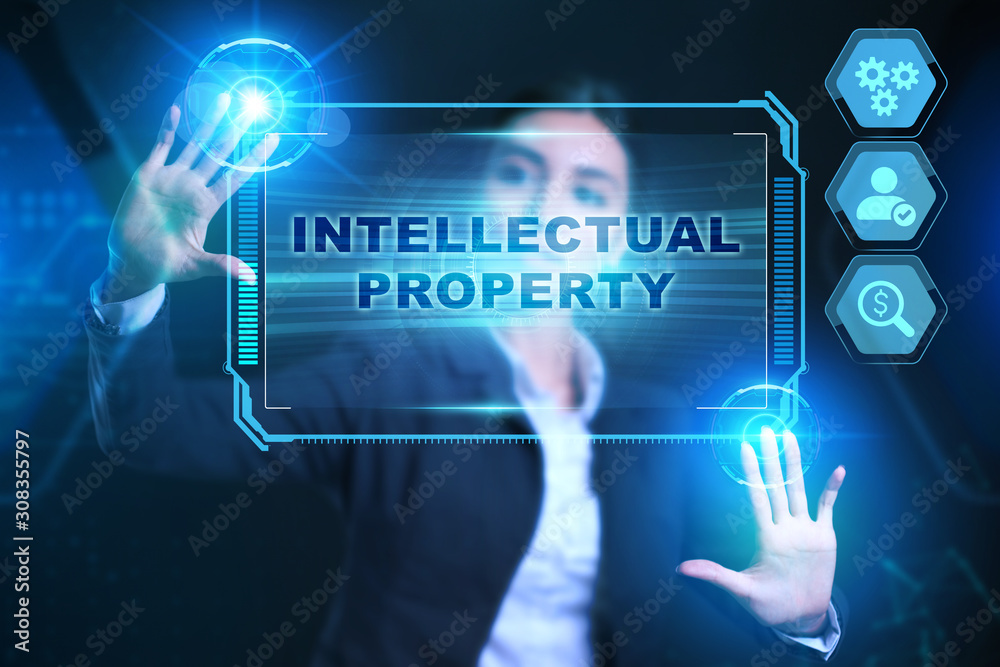 Business, Technology, Internet and network concept. Businessman presses a button Intellectual property on the virtual screen tablet future. Business, Technology, Internet and network concept. Businessman presses a button Intellectual property on the virtual screen tablet future.