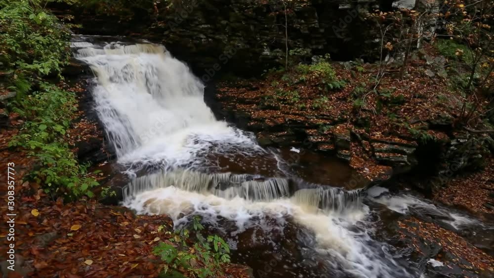 A beautiful splashing waterfall, Mohican Falls, in the autumn woods of Ricketts Glen in Pennsylvania is featured in this seamless video loop A beautiful splashing waterfall, Mohican Falls, in the autumn woods of Ricketts Glen in Pennsylvania is featured in this seamless video loop