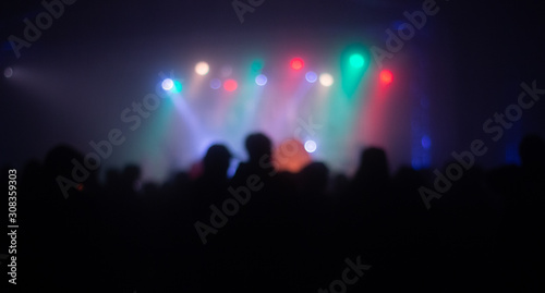 abstrac defocus images people are at a party with colorful lights