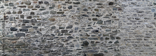 Stone wall texture. Gray stone wall background.