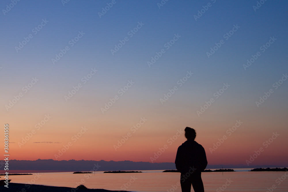 Sunset Silhouette of Person on Beach