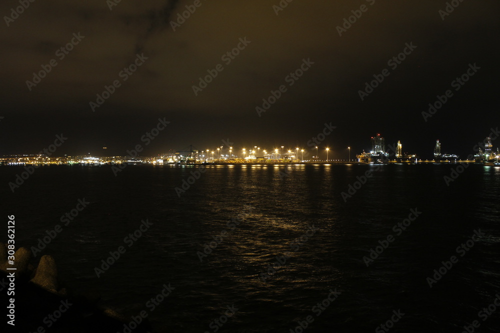 Boat and harbor in to night Boat and harbor in to night