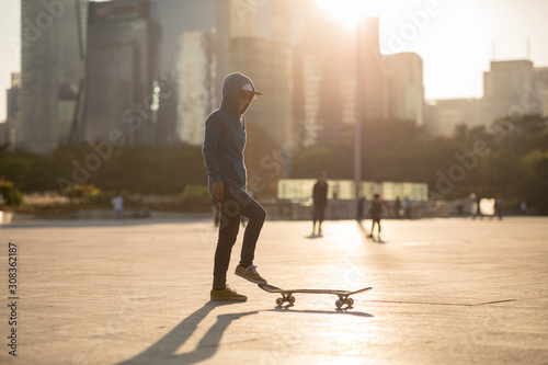 Skateboarder skateboarding at sunset city © lzf