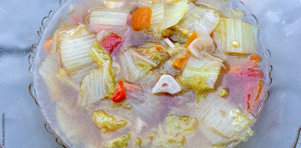 petsai or sayur sawi putih with chopped chili served soupy and warm is cheap food in Indonesia with good taste petsai or sayur sawi putih with chopped chili served soupy and warm is cheap food in Indonesia with good taste