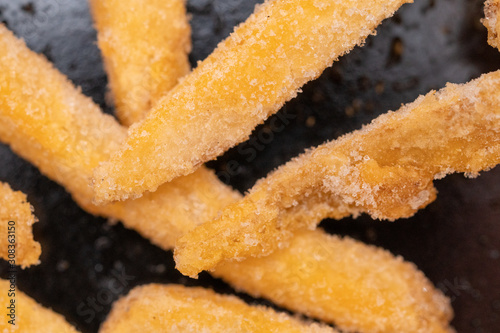 Frozen frosted french fries close up macro .