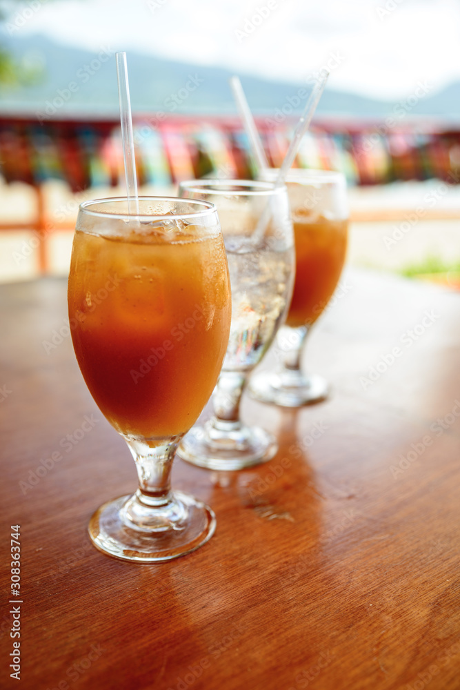 Three wineglasses with cold juice and water Three wineglasses with cold juice and water