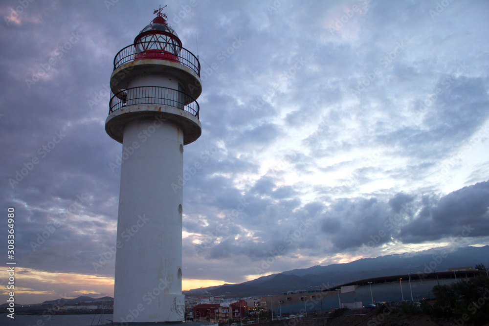 Red lighthouse with cloud sky