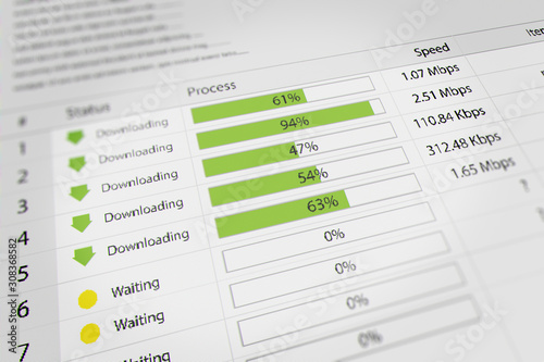 Obraz na plátne Download With Progress Bar, Closeup Process of Downloading Multiple File In Internet on  Computer Monitor Screen
