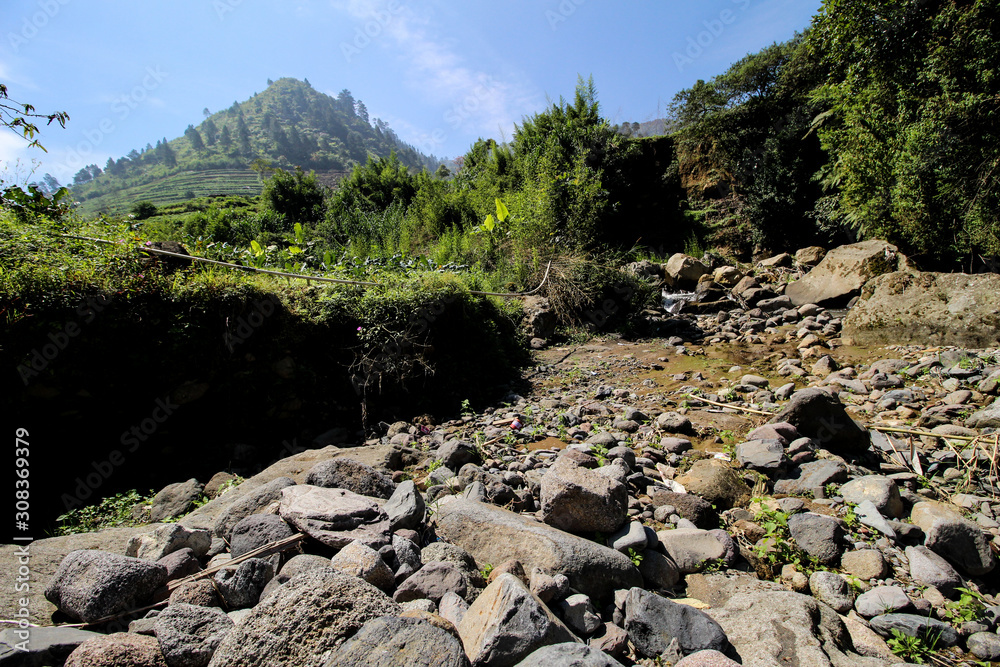 Slow Shutter Speed Image of the Little Rocky River in Dieng Mountains National Park Slow Shutter Speed Image of the Little Rocky River in Dieng Mountains National Park