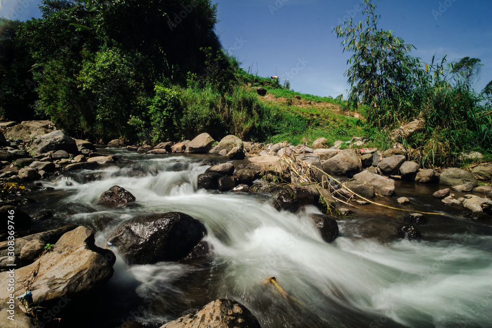 Slow Shutter Speed Image of the Little Rocky River in Dieng Mountains National Park Slow Shutter Speed Image of the Little Rocky River in Dieng Mountains National Park