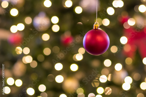 ornament hanging in front of blurry background christmas season