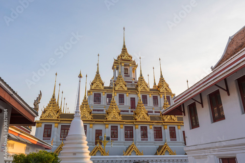 Loha Prasat, The metallic castle covered with gold leaf of Wat Ratchanadda Temple in Bangkok, Thailand. photo