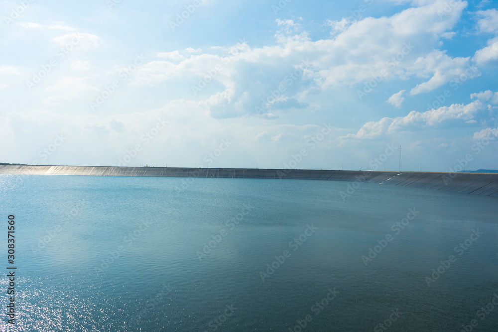 Reservoir and wind turbine at Lam Ta Kong Dam, Nakhon Ratchasima, Thailand.