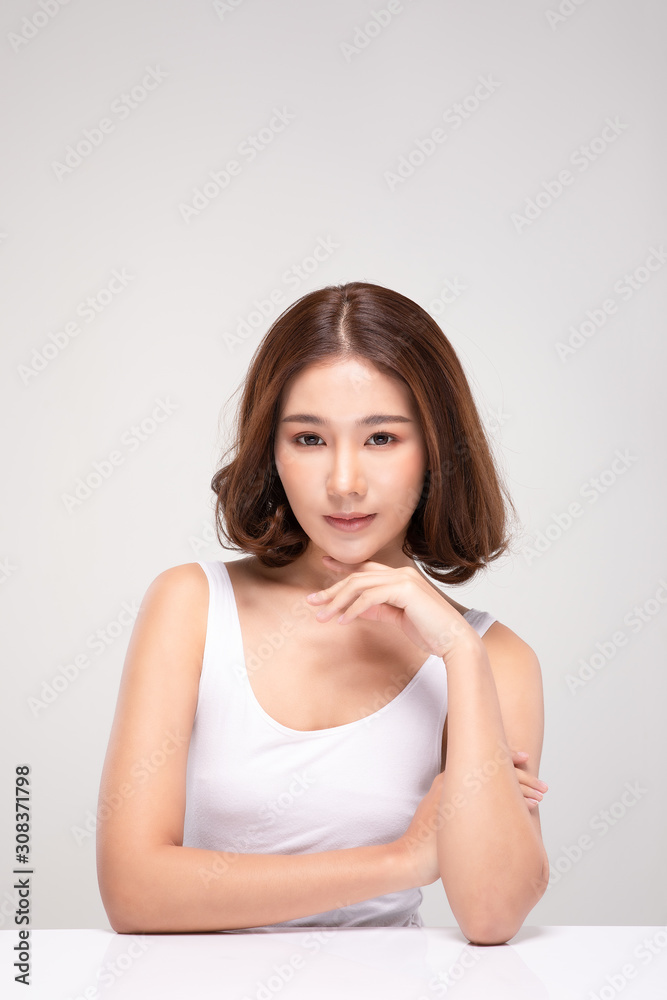 Beautiful Young Asian Woman with short hair Looking While Touching Chin feeling so happy and cheerful with healthy Clean and Fresh skin,isolated on white background,Beauty Cosmetics Concept Beautiful Young Asian Woman with short hair Looking While Touching Chin feeling so happy and cheerful with healthy Clean and Fresh skin,isolated on white background,Beauty Cosmetics Concept