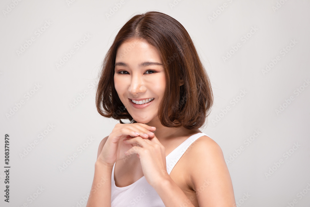 Beautiful Young Asian Woman with short hairs Holding Hands smile feeling so happy and cheerful with healthy Clean and Fresh skin,isolated on white background,Beauty Cosmetics Concept Beautiful Young Asian Woman with short hairs Holding Hands smile feeling so happy and cheerful with healthy Clean and Fresh skin,isolated on white background,Beauty Cosmetics Concept