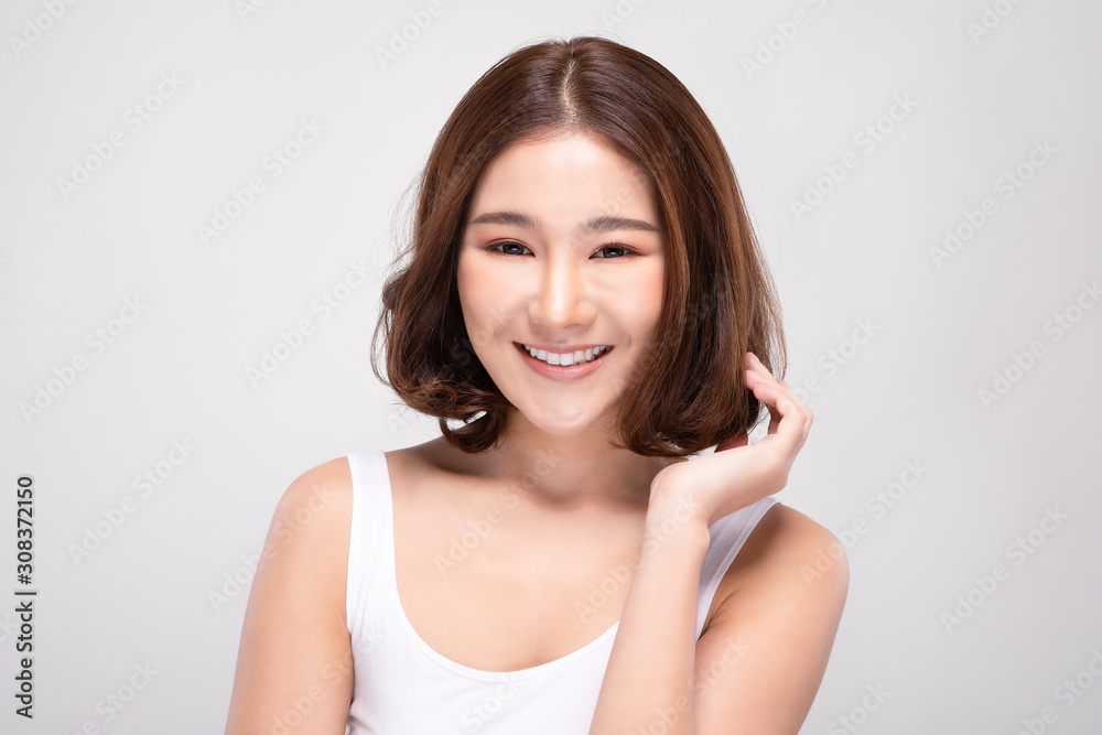 Beautiful Asian woman with short hair looking at camera smile with clean and fresh skin Happiness and cheerful with positive emotional,isolated on gray background,Beauty and Cosmetics Concept Beautiful Asian woman with short hair looking at camera smile with clean and fresh skin Happiness and cheerful with positive emotional,isolated on gray background,Beauty and Cosmetics Concept